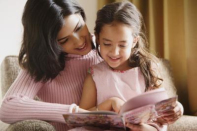 Mother reading to daughter